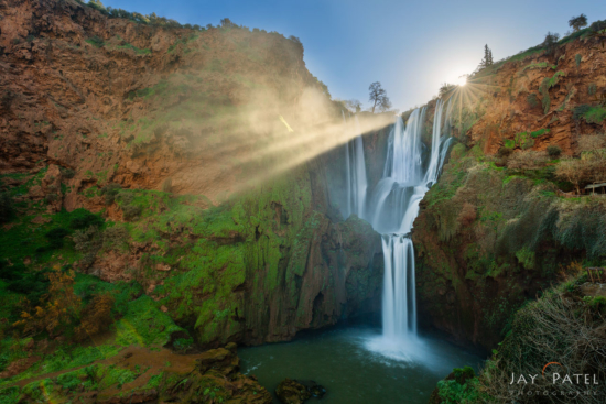 Extreme tonal contrast in landscape photography created by back lit waterfall at Ouzud, Morocco by Jay Patel