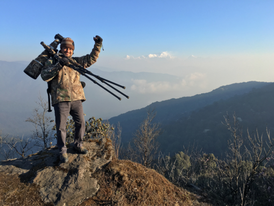 DSLR camera with 600mm prime telephoto lens on a carbon fiber tripod - Kangchenjunga Mountain, India
