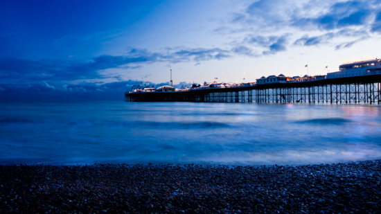 Brighton pier and coastline at night at Blue Hour